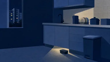 A torch beam on the gap under a kitchen cabinet with a bait station on the floor